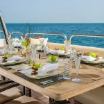 Dinning table on the upper deck in luxurious yacht