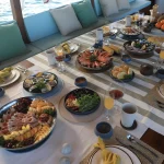 Dining table located on a cruise ship Tourist boats, seafood, drinks